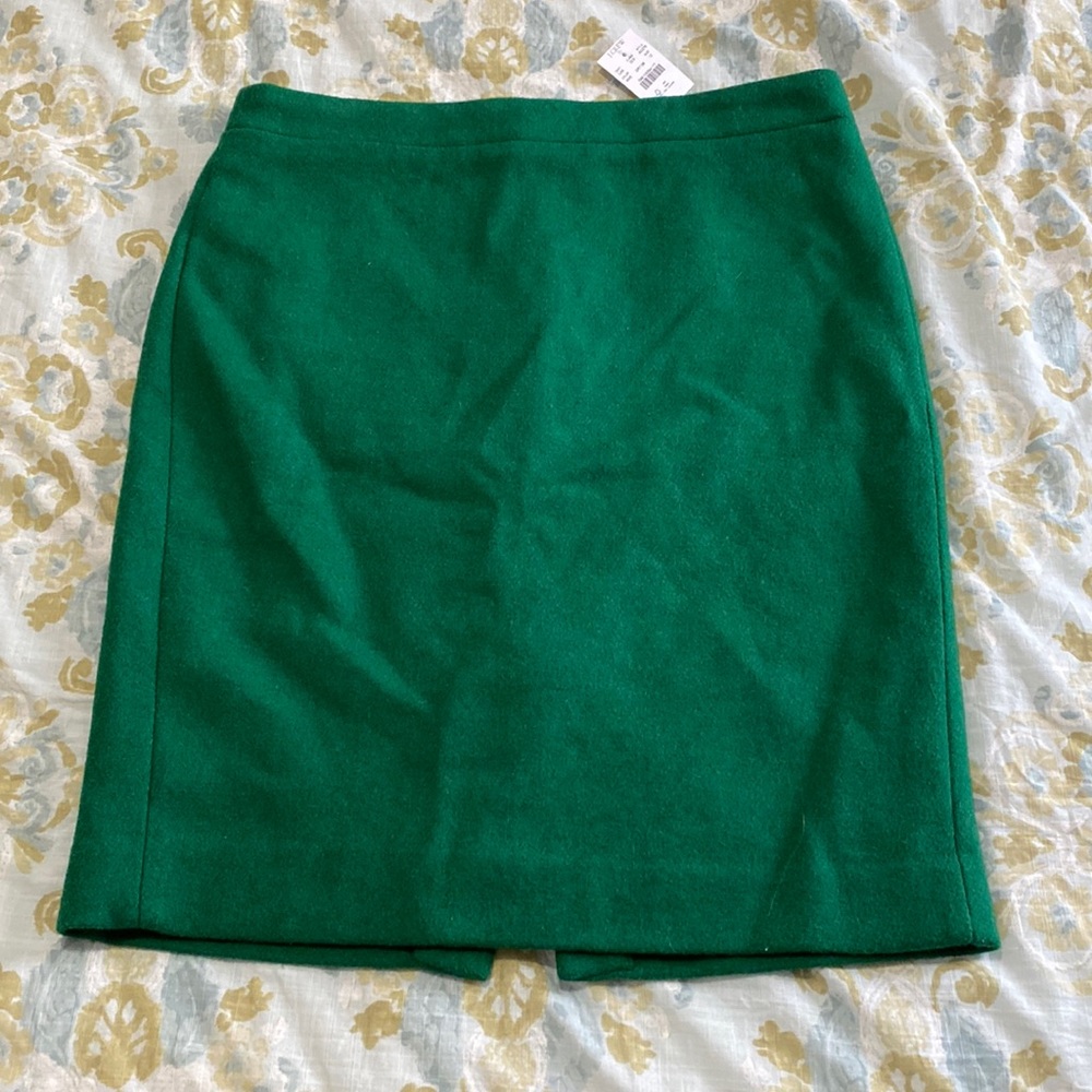 New with tags. Emerald green wool pencil skirt. J. Crew. Size 12.